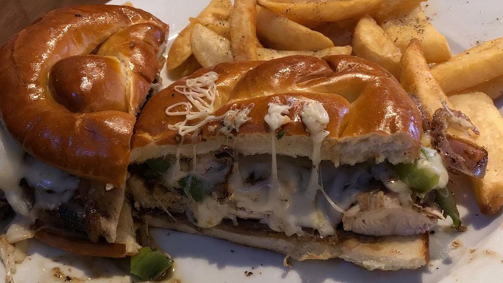 Twisted Chicken Philly · Strips of grilled chicken breast covered with sauteed onion, green pepper, mushrooms and provolone cheese on our famous twisted bun.