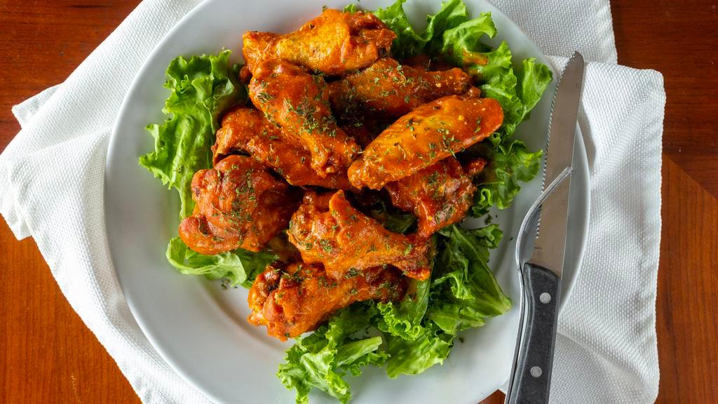 Albanian Wings · Ten crispy wings tossed in our house-made tangy albanian style sauce. We can also toss in spicy buffalo or honey chipotle BBQ at your request. Served with celery.