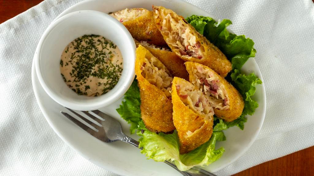 Red Door Egg Rolls · Our signature reuben in 6 giant egg rolls! A creamy combination of corned beef, sauerkraut and Swiss served with our house-made Thousand island dressing.