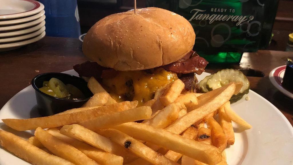 Arlington Burger · Smothered with barbecue sauce, crispy bacon and shredded cheddar cheese.