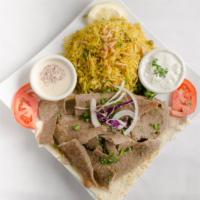 Gyro Platter · Top menu item. Strips of gyro meat topped with onion, tomato and cucumber sauce, served over...