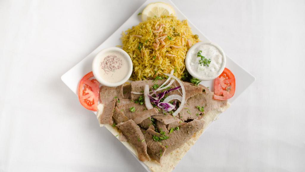 Gyro Platter · Top menu item. Strips of gyro meat topped with onion, tomato and cucumber sauce, served over a bed as basmati rice.