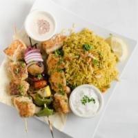 Chicken Kebabs Platter · Marinated chicken, grilled with tomatoes, green pepper and onions, served over a bed of basm...