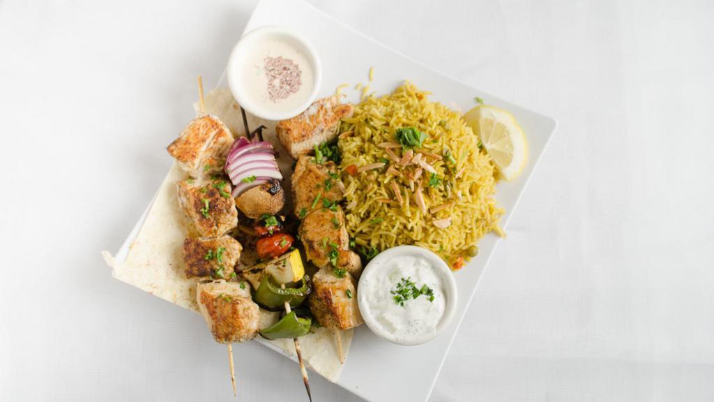 Chicken Kebab Platter · Most popular.two  square of  Marinated chicken, grilled  tomatoes, green pepper and onion, comes with small greek salad.