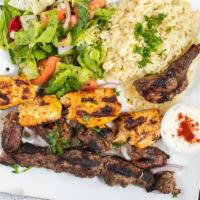 Mix Kebab Platter · Combination of grilled chicken, kofta, lamb, served over a bed of basmati rice.
