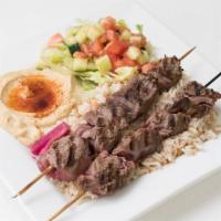 Lamb Kabob · Two skewers of Charbroiled tenderloin cubes served with grilled vegetables.