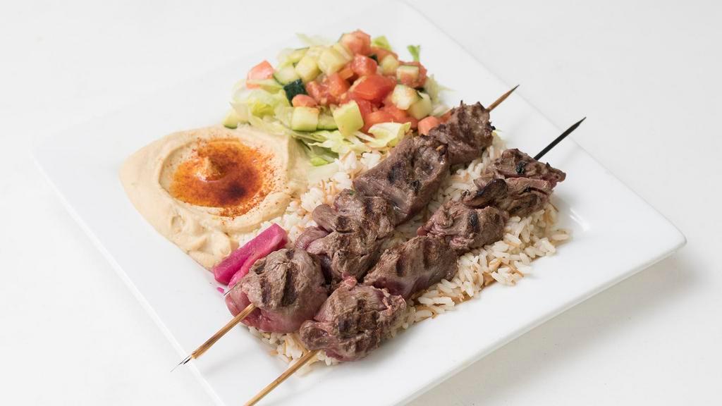 Lamb Kabob · Two skewers of Charbroiled tenderloin cubes served with grilled vegetables.