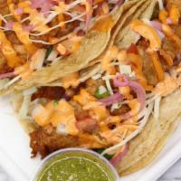 2 - Fish Taco · Beer battered fish fried and topped with  pico de gallo, chipotle creamy sauce, cabbage and ...