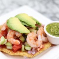 Boiled Shrimp Tostada · Boiled Shrimps cilantro tomato red onion cucumber  spices covered with a cocktail sauce.