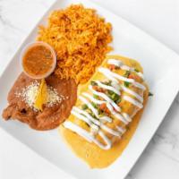 Calgary Chimichanga · Your choice of chicken or beef burrito and cheese deep-fried and topped with espinaca con qu...
