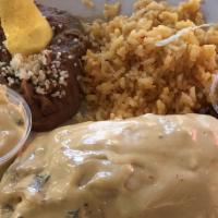 Bruins Burrito Platter · Your choice of beef or chicken rolled in a flour tortilla topped with espinaca con queso sau...