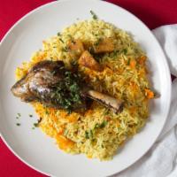 Lamb Shank Meal · Our famous slow roasted lamb shank with two sides of saffron rice, and middle eastern salad