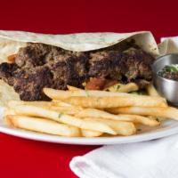 Kafta Kabob Plate Single · Four Skewers of grilled Kafta Kobob mix ( lamb and beef) topped with grilled seasonal veggie...
