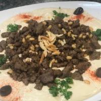 Hommous With Lamb · sauteed with lamb with pine nuts over hommous