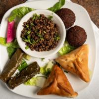 Vegetarian Tray Lunch  · 2 veggie grape leaves ,2 spinach  pies , 2 falafel and mujadara