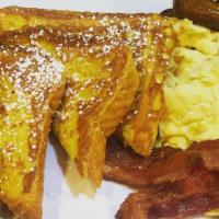 Ultimate Breakfast · Pancakes or French toast or waffle, with two eggs and two strips of bacon and two sausage li...