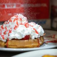 Belgium Waffle · Our thick Belgium waffle served with hot syrup and whipped butter.