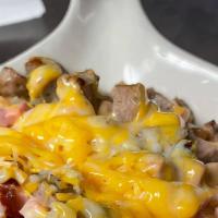 Top Of The World Skillet · Sausage, bacon, ham, onion, green pepper and melted cheese.