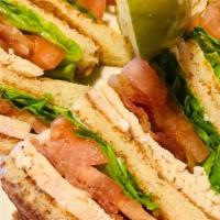 Turkey Club · Thin slices of all white meat turkey topped with lettuce, tomato, crisp bacon and mayo.