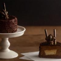 Bourbon Chocolat Bombe · Our bourbon chocolate bombe includes a dark chocolate genoise imbibed with bourbon syrup, a ...