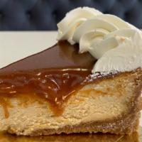 Salted Caramel Cheesecake (Slice) | New · Brown sugar graham crust, salted caramel cheesecake, salted caramel topping and cream.