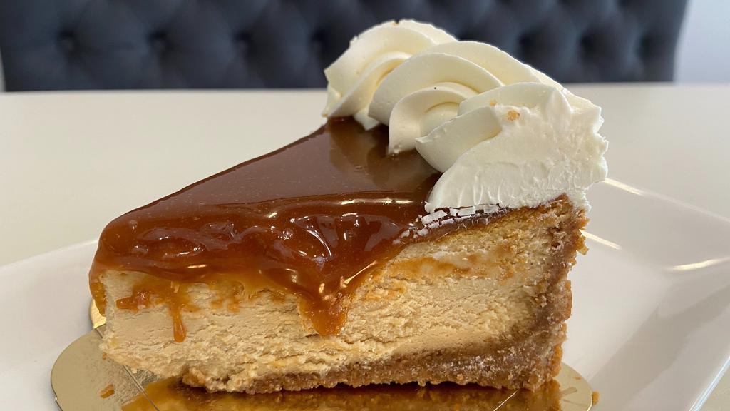 Salted Caramel Cheesecake (Slice) | New · Brown sugar graham crust, salted caramel cheesecake, salted caramel topping and cream.