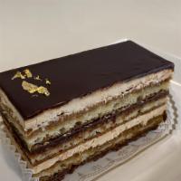 Opera Cake  · Alternate layers or coffee soaked sponge cake, coffee buttercream, chocolate ganache and a c...