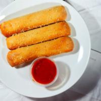 Breadsticks · Three large breadsticks filled with cheese and served with marinara sauce.