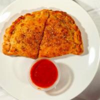 Calzone · Loaded with cheese and two of your favorite pizza toppings, served with a side of our marina...