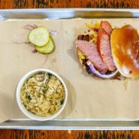 Memphis Mayhem Sandwich · Smokey brisket and pulled pork in our Memphis sauce; topped with a slice of Texas hot link, ...