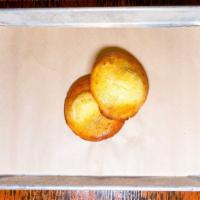 Cornbread Muffin Tops (12) · 12 baked fresh and glazed with Honey Butter.