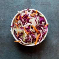 Tangy Coleslaw · Shredded green and red cabbage in a sweet and tangy vinaigrette.