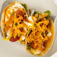 B'Fast Tacos · eggs, bacon, spinach, jalapeno, cheddar, sriracha aoli, and cilantro in corn tortillas