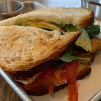 Beast · bacon, fried egg, avocado, spinach, smoked paprika aioli on grilled sourdough (sandwich)