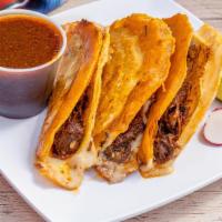 Birria Queso Taco · Stewed beef with tortilla dipped into the broth and smothered in chihuahua cheese, onions an...