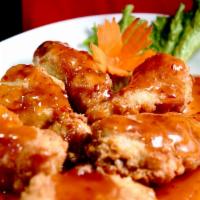 Sweet Chili Wings · Crispy battered chicken wings tossed in sweet and spicy Thai style sauce. Spicy.
