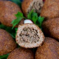 Fried Kibbe · Sauteed onions, grass fed black angus ground beef, salt, herbs and spices. Stuffed into foot...