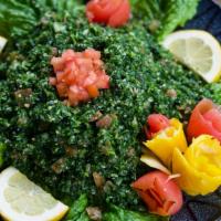 Tabouli Salad (Vegetarain Friendly) · Finely chopped parsley, tomatoes, onion and cracked wheat. Tossed in extra virgin olive oil,...