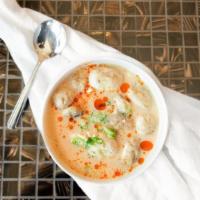 Tom Kha Chicken · Thai style coconut milk soup with chicken, mushrooms, and the elusive flavor of galangal roo...