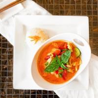 Panang Curry · Spicy. A sweet and spicy curry, mixed with bell peppers, and Thai basil leaves. Served with ...