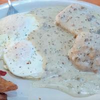 Country Breakfast · This platter includes 1/2 biscuits and gravy, two eggs  any style and two strips of bacon or...