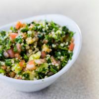 Tabouli Salad · A parsley salad with cracked wheat, fresh tomato, cucumber, green onion. Seasoned with mint,...