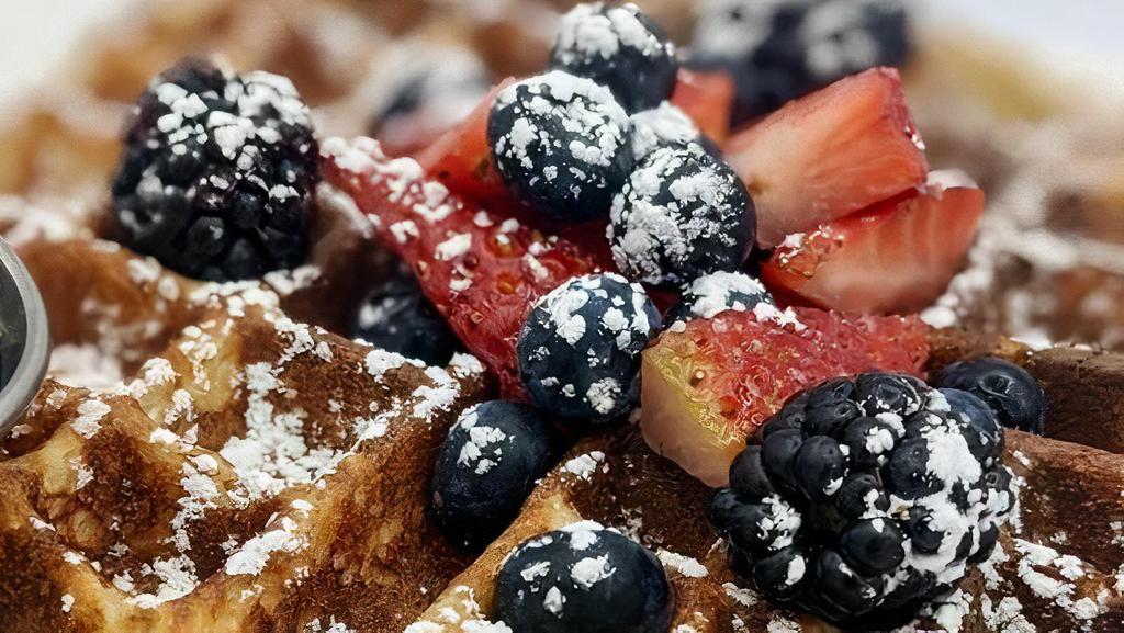 Lemon Ricotta Waffle · Our famous Lemon Ricotta Hotcakes, but a Waffle. Crisp, fluffy, light and delicious. Comes with mixed berries and powdered sugar.