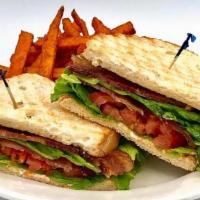 Ultimate Blt · (GF available) Four slices of bacon, lettuce, and thick-cut tomatoes on toasted sourdough wi...
