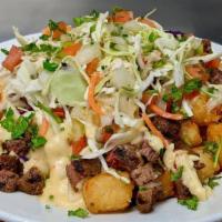 Totchos Grande · Like nachos, but with a midwestern twist: Tater tots topped with queso, pico de gallo, slaw,...