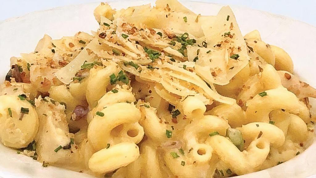 Mac And Cheese · One of our favorite comfort foods on the planet: Cavatappi noodles with a special blend of cheeses including a hint of pepper jack