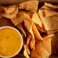 Chips & Queso Dip · Warm Austin-style queso dip, made in-house daily, with our. housemade tortilla chips.