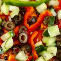 Garden Salad · Romaine lettuce, tomatoes, onions, black olives, cucumbers and mixed peppers.
