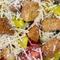 House Salad · Romaine lettuce, tomatoes, cucumbers, red onions, pepperoncini, croutons, and parmesan cheese