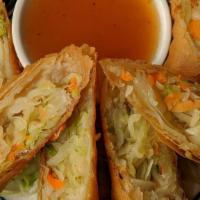 Spring Roll · Golden fried rolls filled with clear noodles, carrots, celery and cabbage served with plum s...